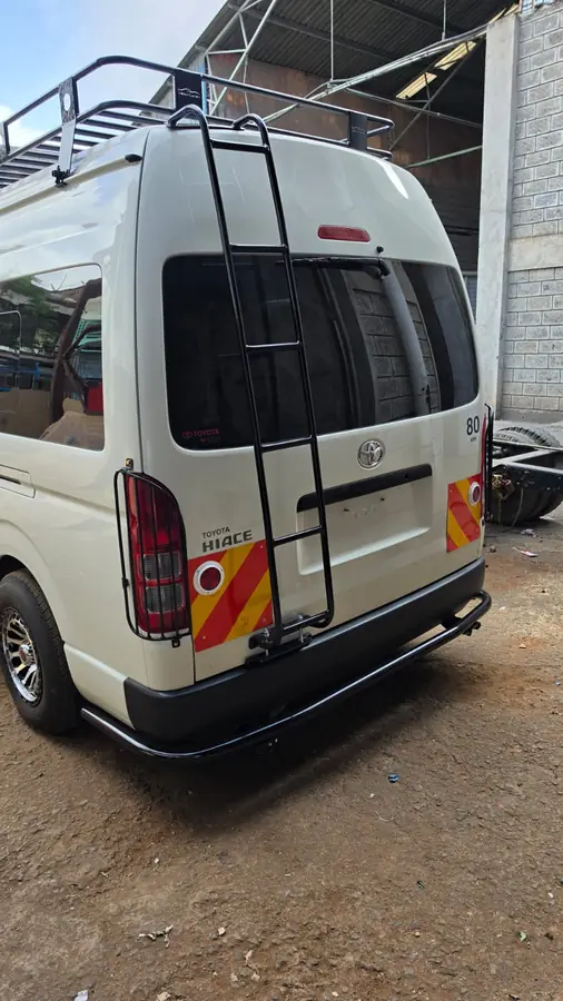 Rear of a Hiace with roof rack, ladder, tail-light guards and rear bumper guard
