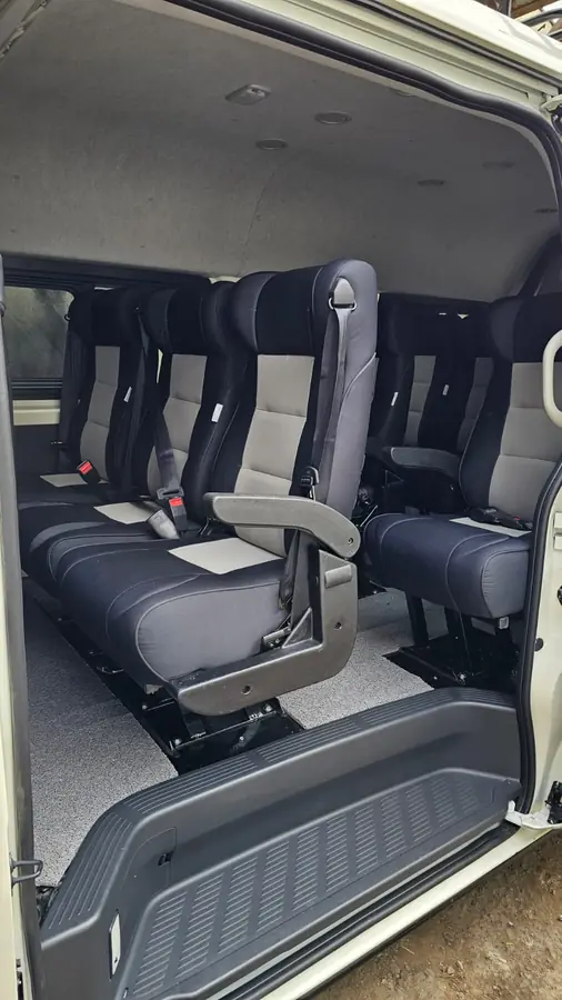 Grey and black executive seats with armrests fitted in a van