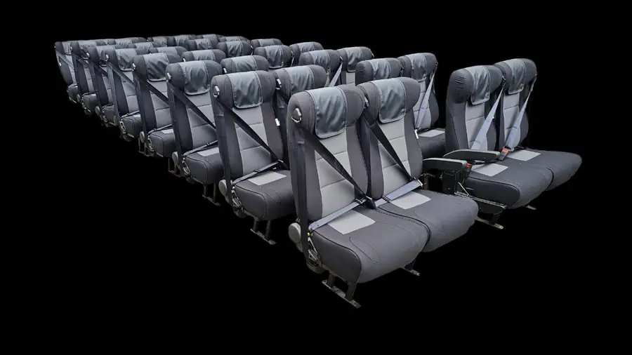 A batch of grey and black executive seats with seat belts