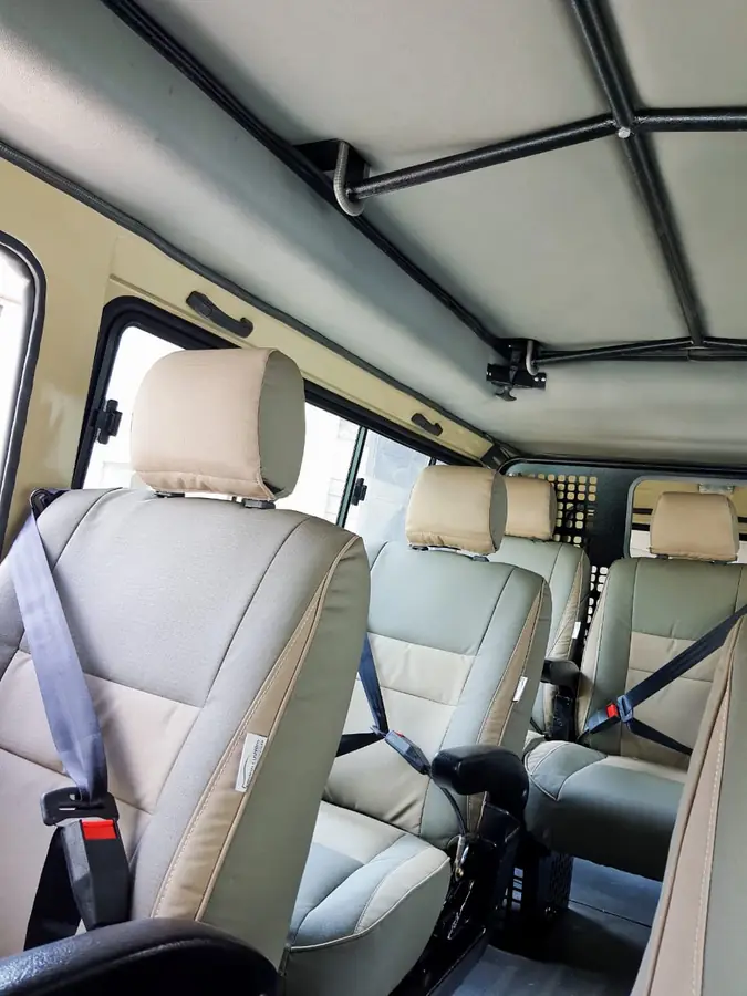 Beige Land Cruiser seats with seat belts fitted in a Land Cruiser