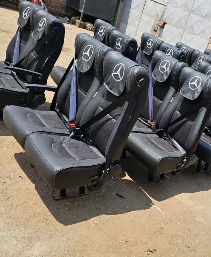 Bus seats with the Mercedes-Benz star on each headrest