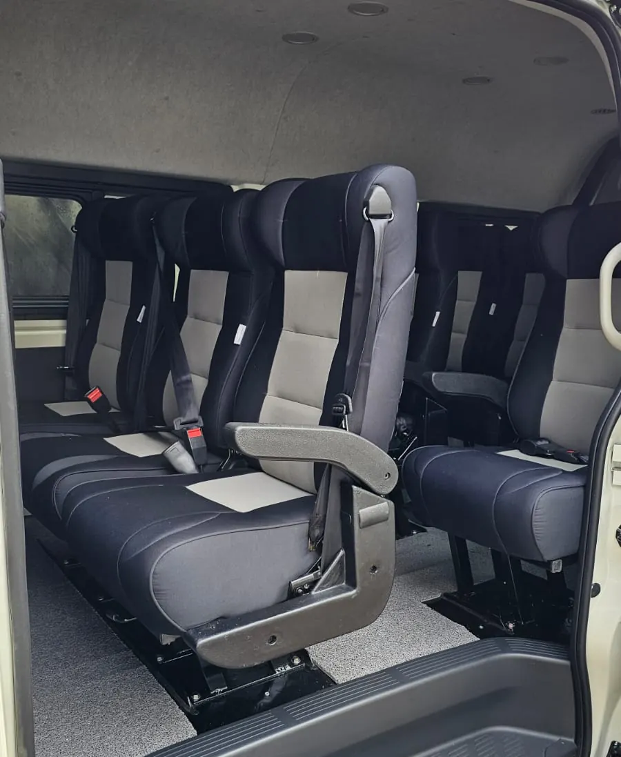 Grey and black executive seats with armrests fitted in a van