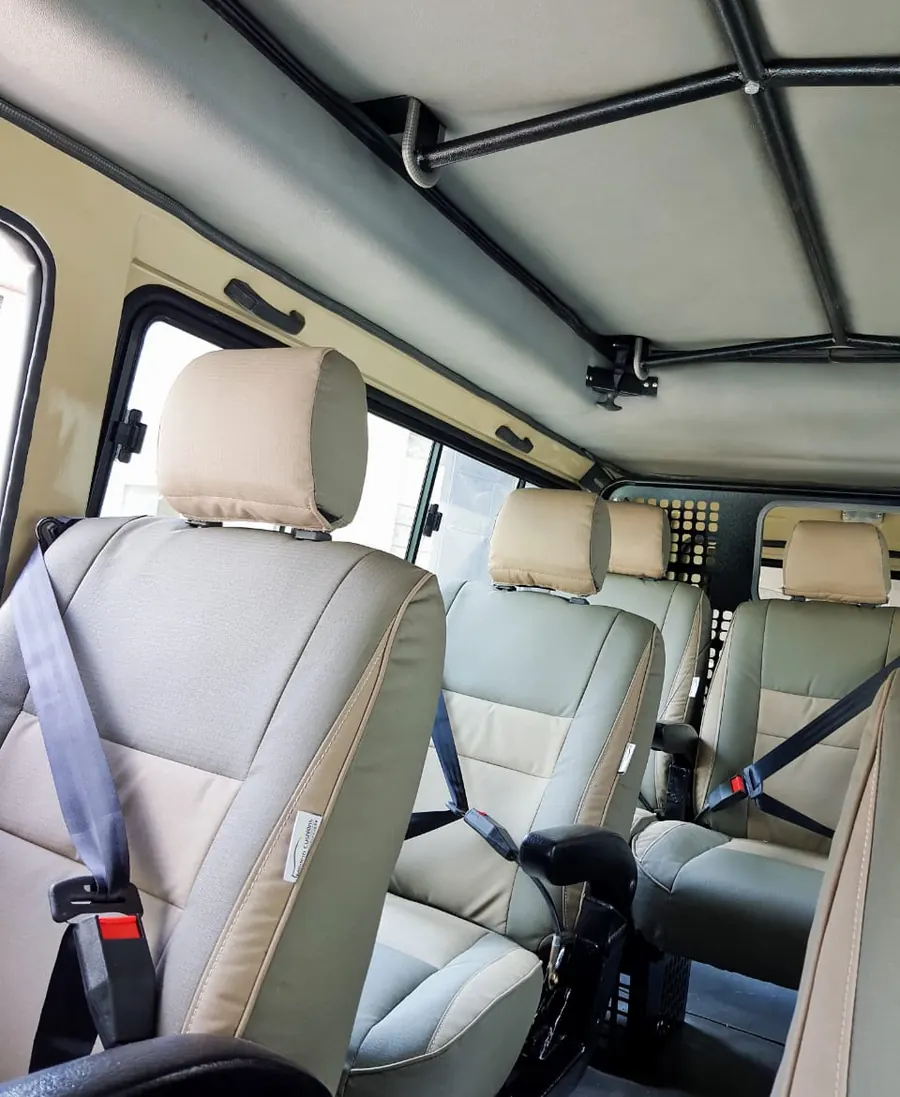 Beige Land Cruiser seats with seat belts fitted in a Land Cruiser