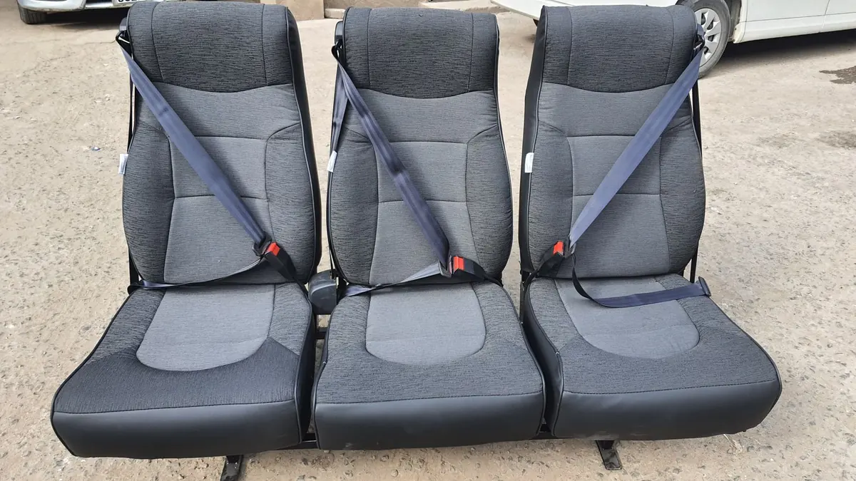 Shuttle bench seats with seat belts ready for fitting