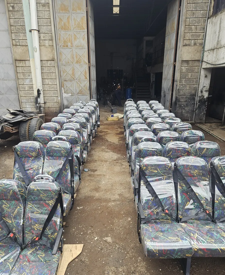 Rows of standard seats with seat belts in the workshop yard